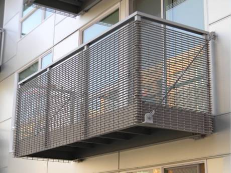 Steel grating infill panels are used as fences in the balcony.