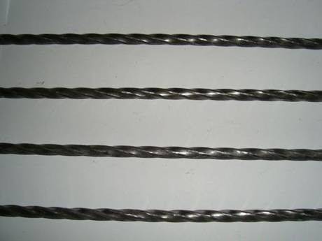 Four twisted bars of galvanized steel grating.