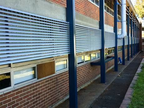 A louver grating placed on the outside of the window to block the sunlight.