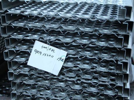 Many O-grip safety grating plates stacked together.