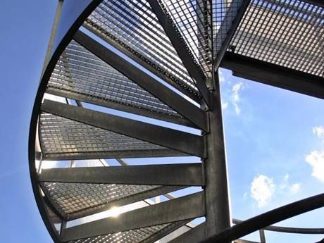 This is a observation tower with steel grating stairs.