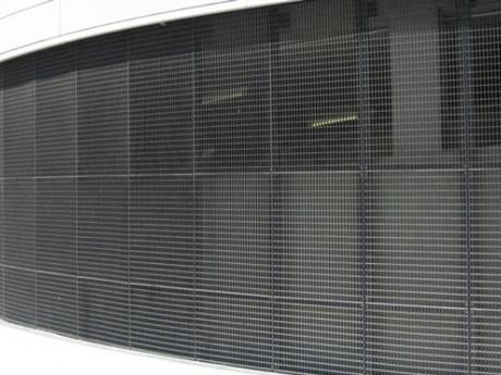 The black press-locked steel grating used as the outer wall decoration of a building.