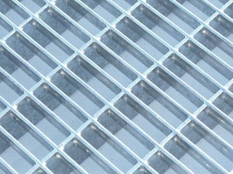 A press-locked steel grating with small mesh size.