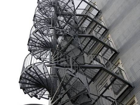 Steel grating spiral stairs used as fire escape stairs to protect people's safety.