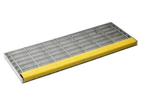 A welded stair tread steel grating with abrasive nosing.