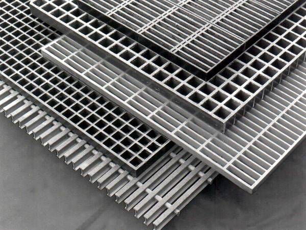 Various types of steel gratings are placed on the ground.