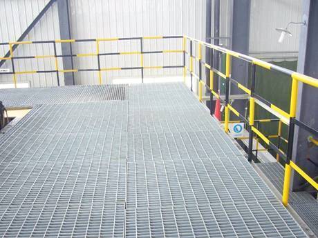 This is a corner of factory with steel grating floor.