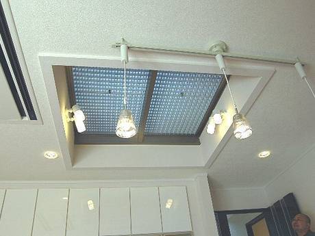 This is a roof with steel grating skylight and beautiful lights.