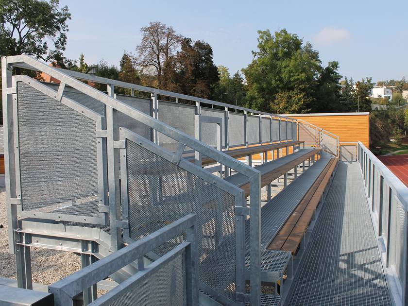 A three-storey steel grating stands on the outside of the playground runway.